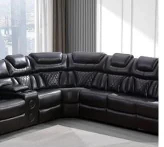 Black leather sectional sofa in modern living room with -24% discount badge and price $1,899.00