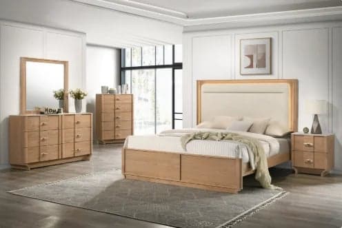 Modern bedroom suite featuring a natural wood bed frame with upholstered headboard, matching nightstands, dresser, and mirror in a bright, minimalist room