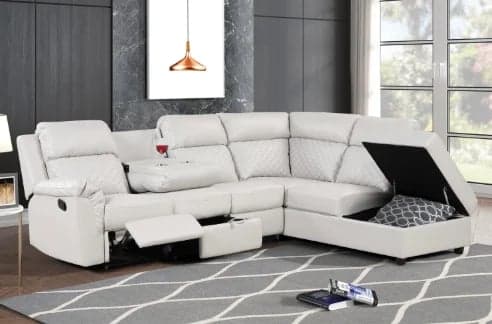 White leather sectional sofa with reclining seats and cup holders in a modern living room with geometric area rug